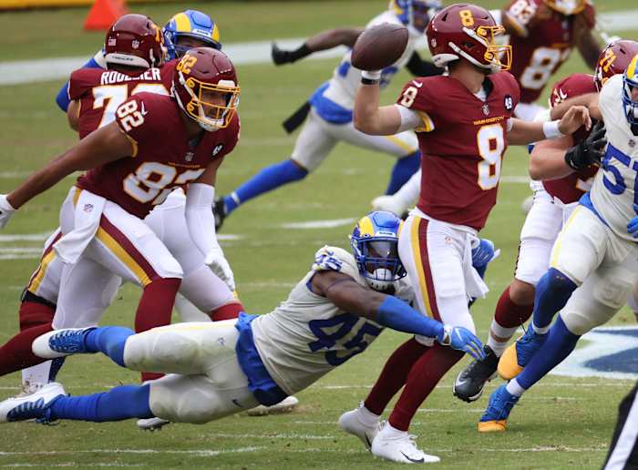 Los Angeles Rams linebacker Ogbonnia Okoronkwo pressures Washington quarterback