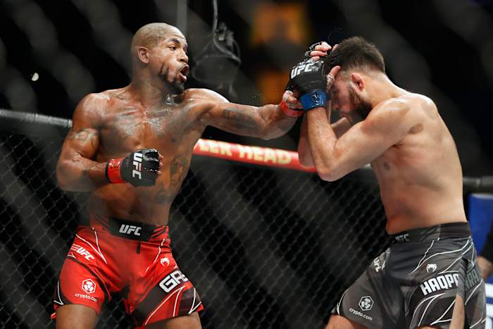 Bobby Green (l.) fights Nasrat Haqparast during UFC 271 at Toyota Center.