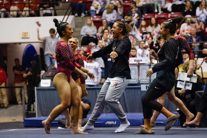 Luisa Blanco celebrates on floor against Missouri