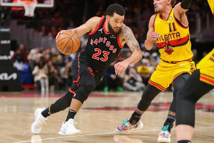 Feb 26, 2022; Atlanta, Georgia, USA; Toronto Raptors guard Fred VanVleet (23) drives on Atlanta Hawks guard Trae Young (11) in the second quarter at State Farm Arena.