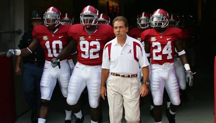 Alabama football coach Nick Saban and Crimson Tide players before a game in the SEC.
