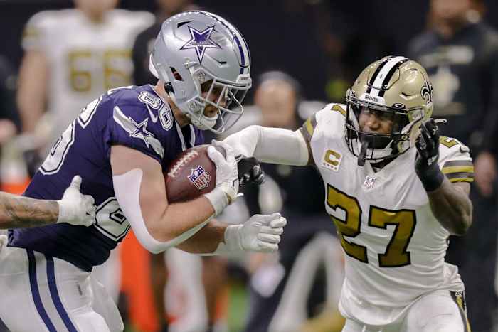 New Orleans Saints safety Malcolm Jenkins (27) tackles Dallas tight end Dalton Schultz (86). Mandatory Credit: Stephen Lew-USA TODAY Sports