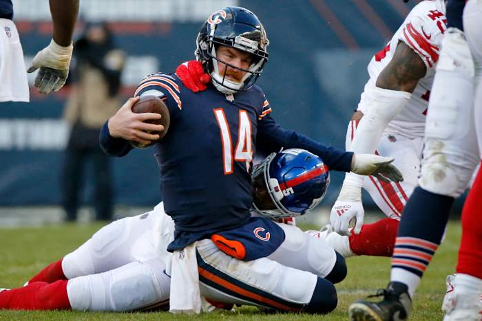 Jan 2, 2022; Chicago, Illinois, USA; Chicago Bears quarterback Andy Dalton (14) reacts while being tackled by New York Giants outside linebacker Quincy Roche (95) during the second half at Soldier Field. Mandatory Credit: Jon Durr-USA TODAY Sports