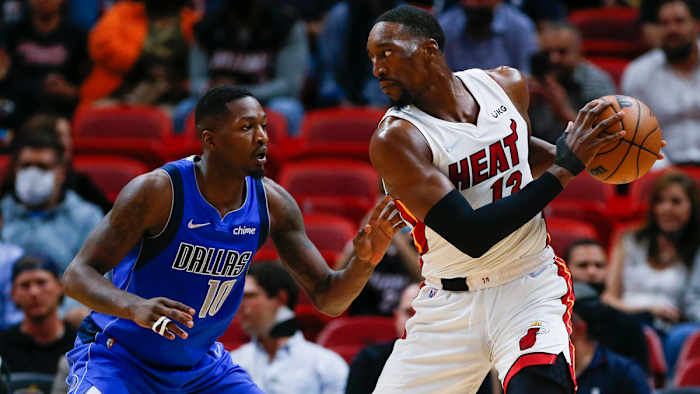 Miami Heat center Bam Adebayo (13) protects the basketball from Dallas Mavericks forward Dorian Finney-Smith.