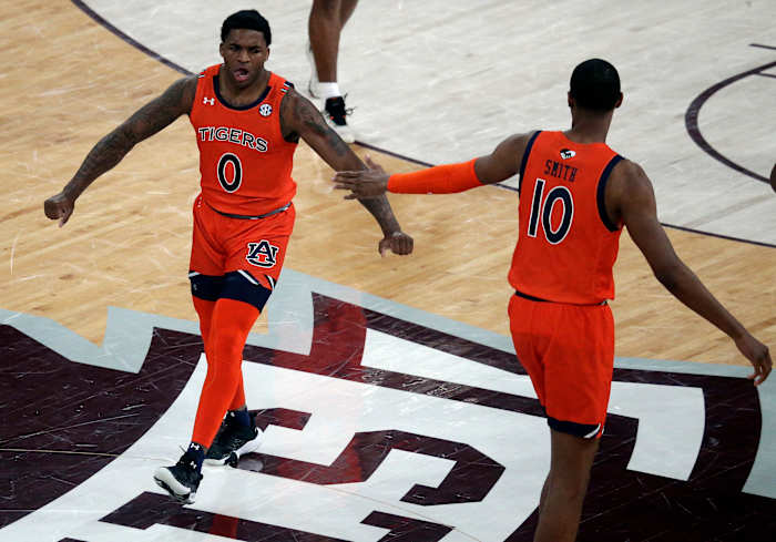 Mar 2, 2022; Starkville, Mississippi, USA; Auburn Tigers guard K.D. Johnson (0) reacts after a basket during the first half again the Mississippi State Bulldogs at Humphrey Coliseum. Mandatory Credit: Petre Thomas-USA TODAY Sports