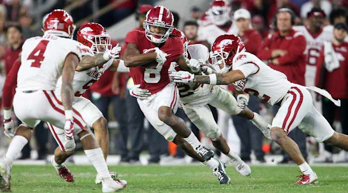 Nov 20, 2021; Tuscaloosa, Alabama, USA; Alabama Crimson Tide wide receiver John Metchie III (8) runs against the Arkansas Razorbacks after making a catch at Bryant-Denny Stadium. Alabama won 42-35. Mandatory Credit: Gary Cosby Jr.-USA TODAY Sports