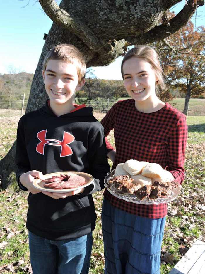 Various types of cooked deer meat and biscuits.