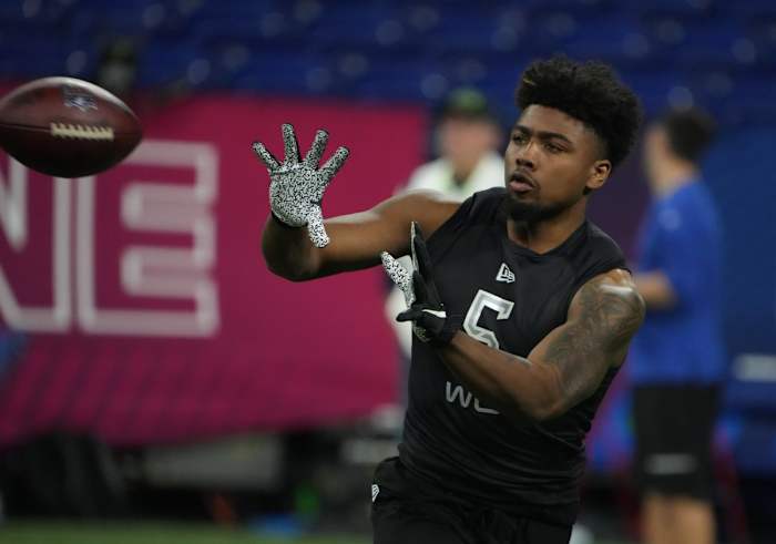 Arkansas wide receiver Treylon Burks (WO05) goes through drills during the 2022 NFL Scouting Combine at Lucas Oil Stadium.