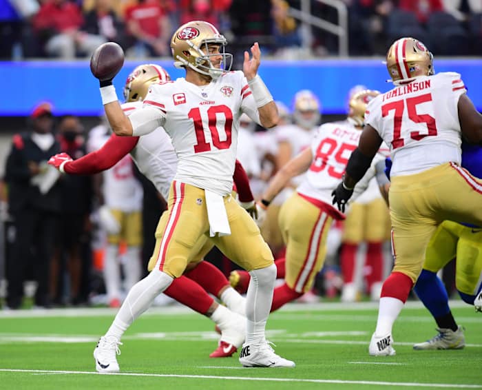 Jan 30, 2022; Inglewood, California, USA; San Francisco 49ers quarterback Jimmy Garoppolo throws a pass against the Los Angeles Rams in the first half during the NFC Championship Game at SoFi Stadium. Mandatory Credit: Gary A. Vasquez-USA TODAY Sports