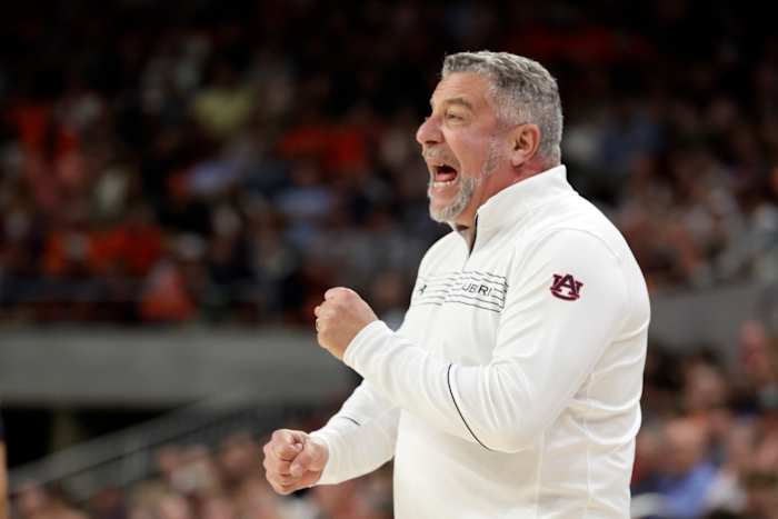 Auburn head coach Bruce Pearl signals to players during the first half of an NCAA college basketball game against South Carolina, Saturday, March 5, 2022, in Auburn, Ala. (AP Photo/Butch Dill)