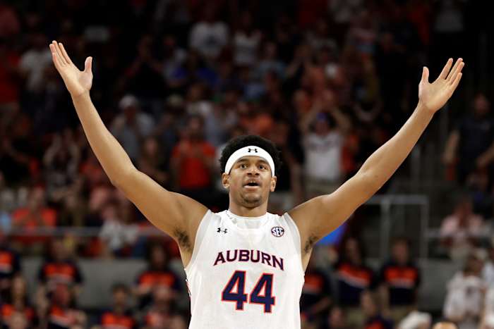 Auburn center Dylan Cardwell (44) reacts after a score against South Carolina during the first half of an NCAA college basketball game Saturday, March 5, 2022, in Auburn, Ala. (AP Photo/Butch Dill)