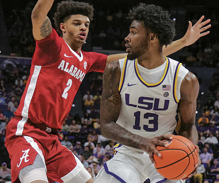 LSU Tigers forward Tari Eason (13) dribbles against Alabama Crimson Tide forward Darius Miles (2) during the first half at the Pete Maravich Assembly Center.