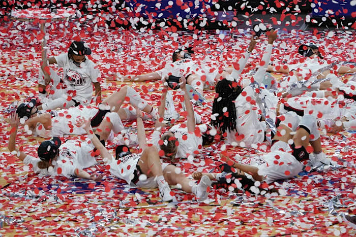 Mar 7, 2021; Las Vegas, NV, USA; Stanford Cardinal players celebrate in confetti after the Pac-12 Conference tournament championship against the UCLA Bruins at Mandalay Bay Events Center. Stanford defeated UCLA 75-55. Mandatory Credit: Kirby Lee-USA TODAY Sports