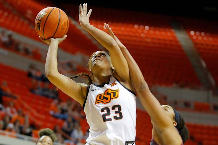 Oklahoma State Cowgirls guard Lauren Fields (23) puts up a shot beside Oklahoma Sooners forward Nydia Lampkin (21) during a women's Bedlam basketball game between the Oklahoma State University Cowgirls (OSU) and the University of Oklahoma Sooners (OU) at Gallagher-Iba Arena in Stillwater, Okla., Wednesday, March 2, 2022. Women's Bedlam Basketball