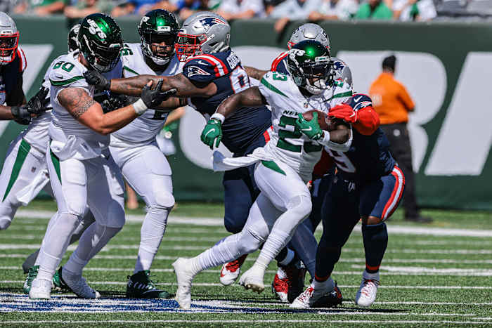 Jets running back Tevin Coleman runs against Patriots