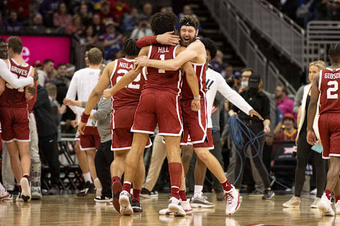 Mar 10, 2022; Kansas City, MO, USA; Oklahoma Sooners center Tanner Groves (35) hugs teammate Oklahoma Sooners forward Jalen Hills (1) after defeating the Baylor Bears at T-Mobile Center.
