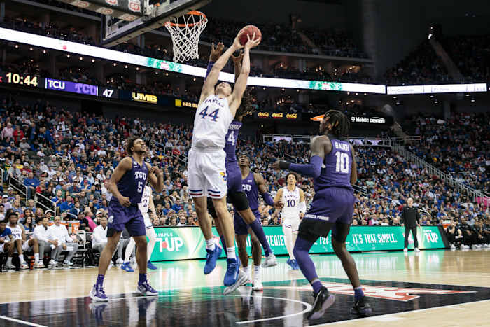 Mar 11, 2022; Kansas City, MO, USA; Kansas Jayhawks forward Mitch Lightfoot (44) goes up for a rebound during the second half against the TCU Horned Frogs at T-Mobile Center. Mandatory Credit: William Purnell-USA TODAY Sports