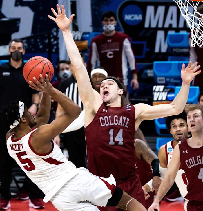 Colgate Raiders forward Keegan Records (14) attempts to block the ball as Arkansas Razorbacks guard Moses Moody (5) attempts to shoot the ball during the first round of the 2021 NCAA Tournament.