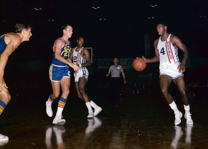 Unknown date; Cincinnati, OH, USA: FILE PHOTO; Cincinnati Royals guard Oscar Robertson (14) is defended by San Francisco Warriors guard Jim King (21) at Cincinnati Gardens.