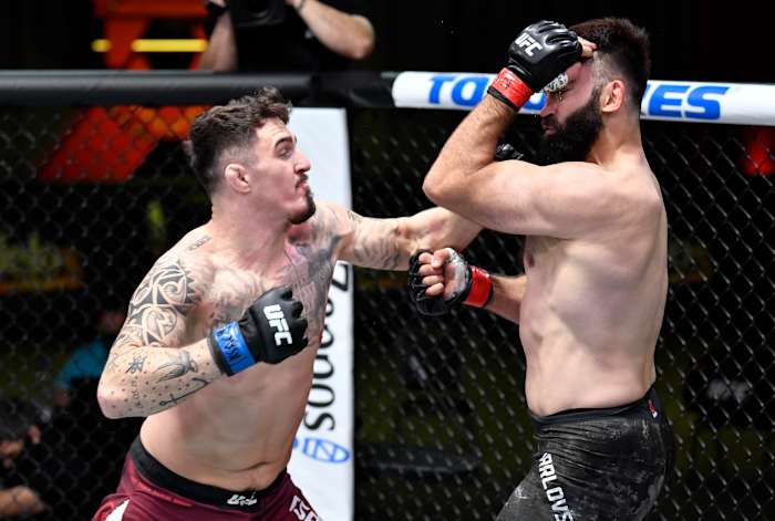 British heavyweight Tom Aspinall (l.) faces Russian striker Alexander Volkov at UFC Fight Night 204.
