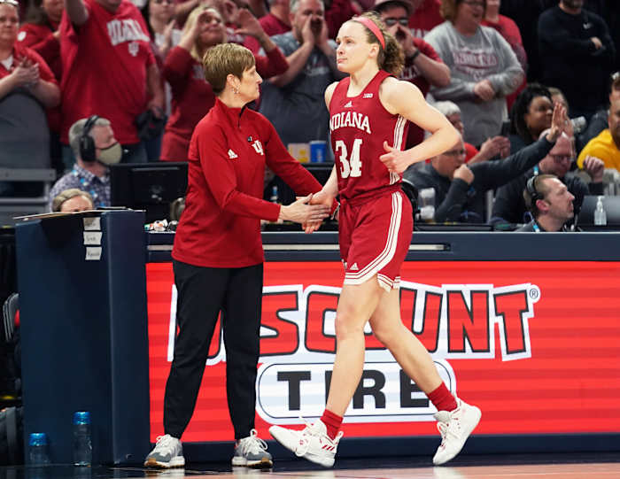 Grace Berger receives a high-five from Indiana head coach Teri Moren.