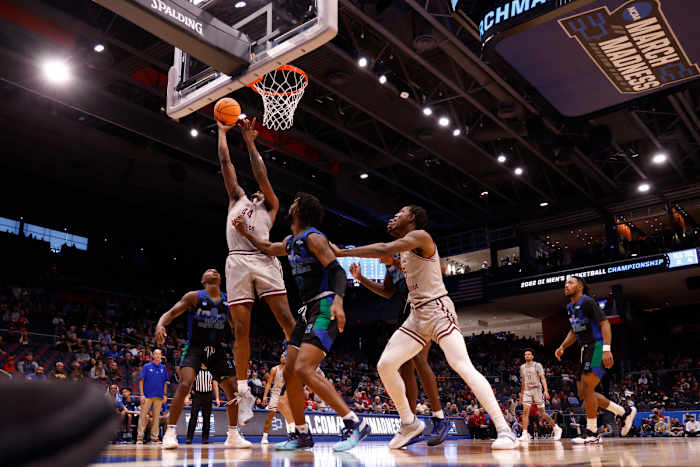 Mar 15, 2022; Dayton, OH, USA; Texas Southern Tigers forward Brison Gresham (44) goes to the basket pressured by Texas A&M-CC Islanders forward San Antonio Brinson (23) in the first half during the First Four of the 2022 NCAA Tournament at UD Arena. Mandatory Credit: Rick Osentoski-USA TODAY Sports