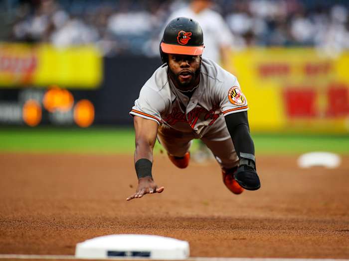 Aug 4, 2021; Bronx, New York, USA; Baltimore Orioles center fielder Cedric Mullins (31) slides into third base in the first inning against the New York Yankees at Yankee Stadium.