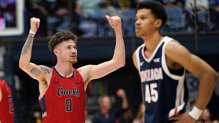 Saint Mary’s Logan Johnson lifts his arms in celebration vs Gonzaga