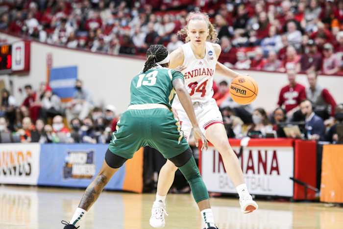 Grace Berger is met by a Charlotte defender.
