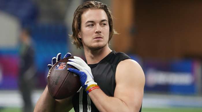 Kenny Pickett prepares to throw a pass at the NFL scouting combine.