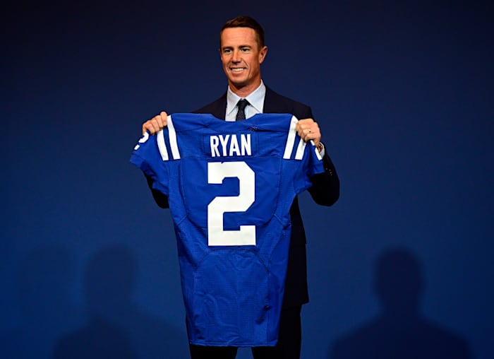Mar 22, 2022; Indianapolis, IN, USA; Indianapolis Colts Quarterback Matt Ryan (2) holds up his new uniform after a press conference to announce his joining of the team at Indiana Farm Bureau Football Center. Mandatory Credit: Marc Lebryk-USA TODAY Sports