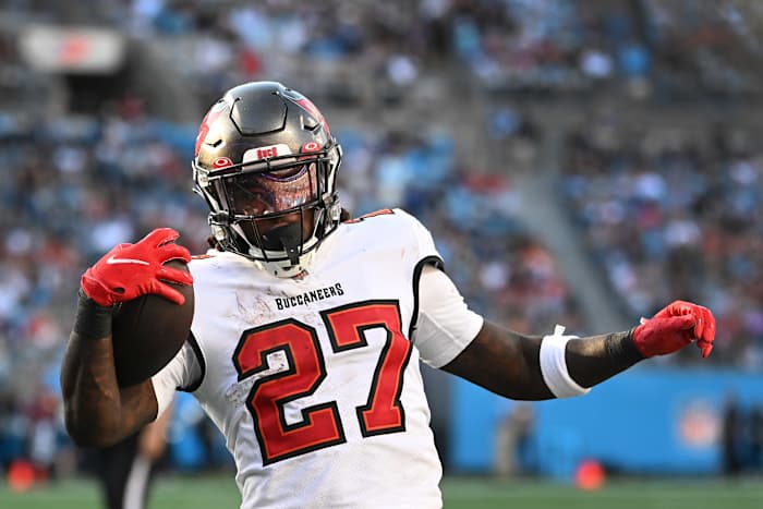 Dec 26, 2021; Charlotte, North Carolina, USA; Tampa Bay Buccaneers running back Ronald Jones (27) scores a touchdown in the third quarter at Bank of America Stadium. Mandatory Credit: Bob Donnan-USA TODAY Sports