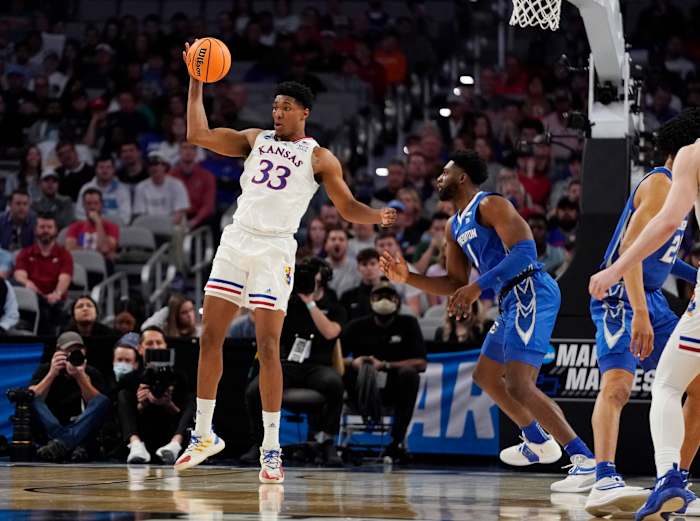 Mar 19, 2022; Fort Worth, TX, USA; Kansas Jayhawks forward David McCormack (33) backs in against Creighton Bluejays forward KeyShawn Feazell (1) during the second round of the 2022 NCAA Tournament at Dickies Arena. Mandatory Credit: Chris Jones-USA TODAY Sports