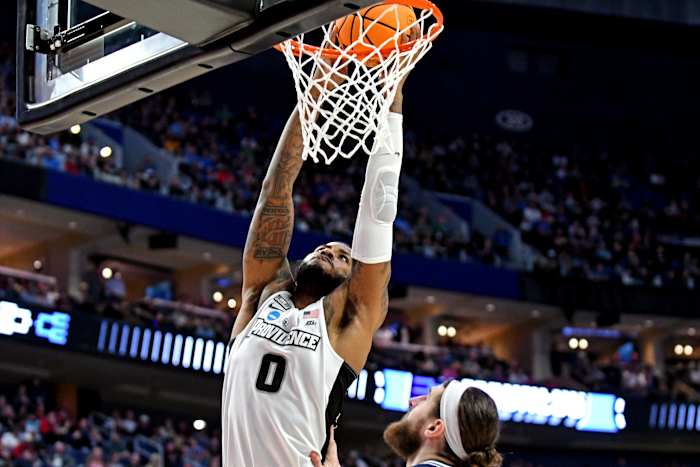 Mar 19, 2022; Buffalo, NY, USA; Providence Friars center Nate Watson (0) dunks the ball against Richmond Spiders forward Grant Golden (33) during the second round of the 2022 NCAA Tournament at KeyBank Center. Mandatory Credit: Mark Konezny-USA TODAY Sports