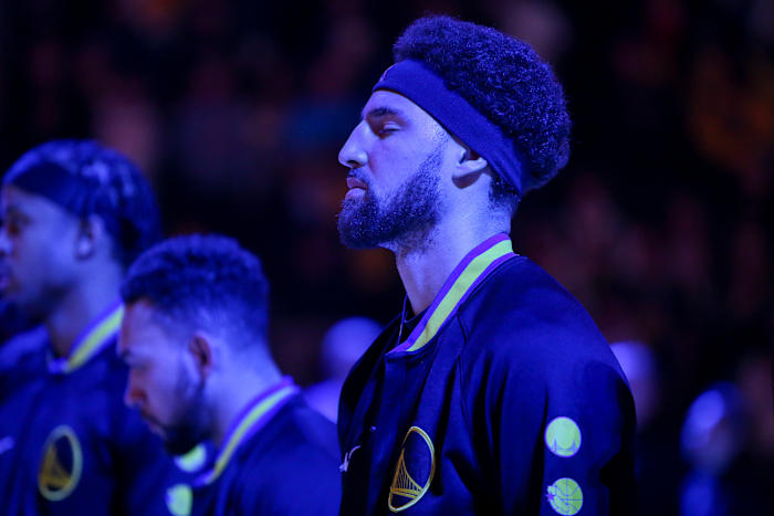 Mar 25, 2022; Atlanta, Georgia, USA; Golden State Warriors guard Klay Thompson (11) during the national anthem before a game against the Atlanta Hawks at State Farm Arena.