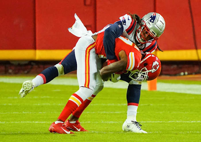 Oct 5, 2020; Kansas City, Missouri, USA; New England Patriots cornerback Stephon Gilmore (24) tackles Kansas City Chiefs wide receiver Mecole Hardman (17) at Arrowhead Stadium. Mandatory Credit: Jay Biggerstaff-USA TODAY Sports