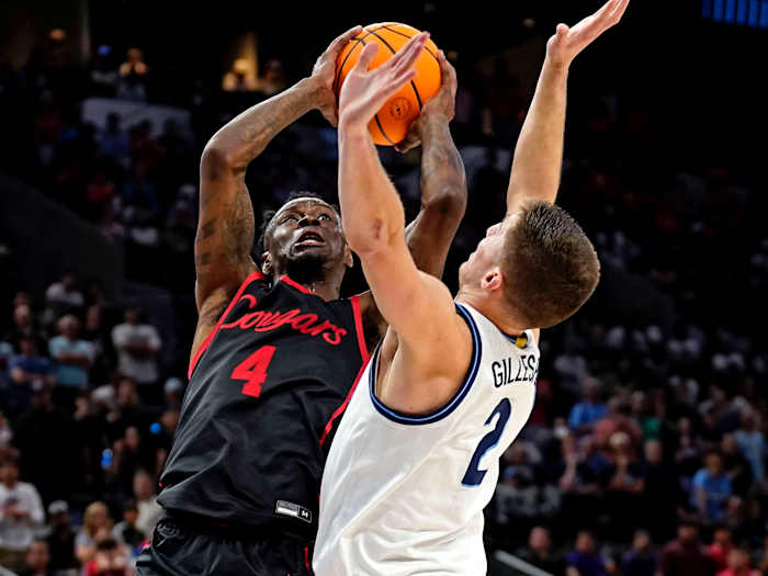 Houston Cougars guard Taze Moore (4) shoots the ball against Villanova Wildcats guard Collin Gillespie (2) during the second half.