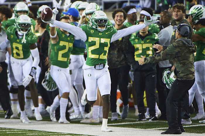 Nov 13, 2021; Eugene, Oregon, USA; Oregon Ducks safety Verone McKinley III (23) celebrates after intercepting a pass against the Washington State Cougars during the first half at Autzen Stadium. Mandatory Credit: Troy Wayrynen-USA TODAY Sports