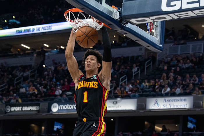 Jalen Johnson dunks the ball.