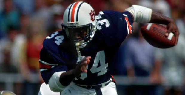 Auburn Tigers running back Bo Jackson on a rushing attempt during a college football game in the SEC.