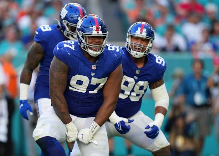 Dec 5, 2021; Miami Gardens, Florida, USA; New York Giants defensive tackle Dexter Lawrence (97) celebrates his tackle of Miami Dolphins running back Salvon Ahmed (not pictured) during the second half at Hard Rock Stadium.