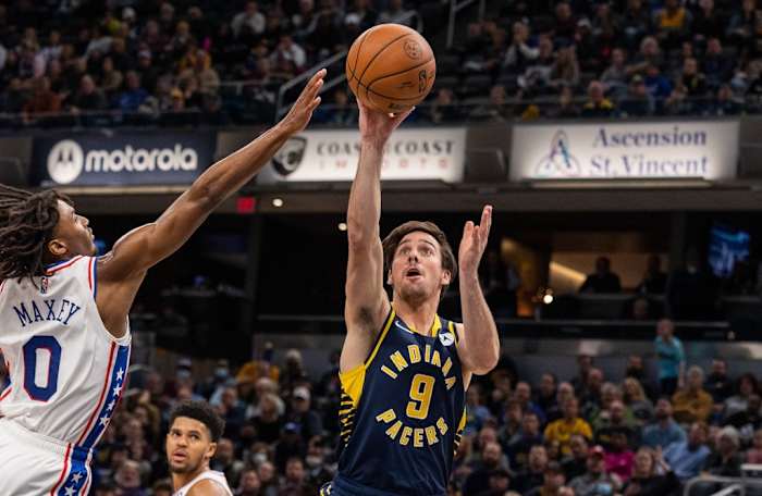 T.J. McConnell shots a floater as 76ers' Tyrese Maxey challenges.