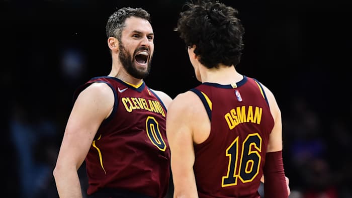 Cleveland Cavaliers forward Kevin Love (0) celebrates with forward Cedi Osman (16) after a three point basket.