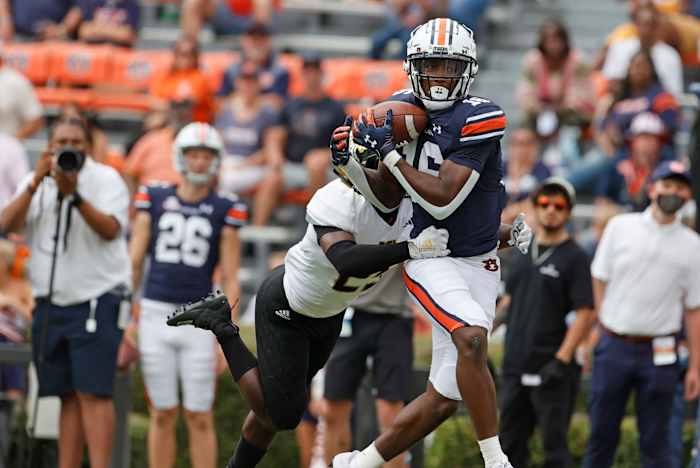 Sep 11, 2021; Auburn, Alabama, USA; Auburn Tigers wide receiver Malcolm Johnson Jr. (16) makes a catch as Alabama State Hornets defensive back Rodney Echols (25) defends during the third quarter at Jordan-Hare Stadium. Mandatory Credit: John Reed-USA TODAY Sports