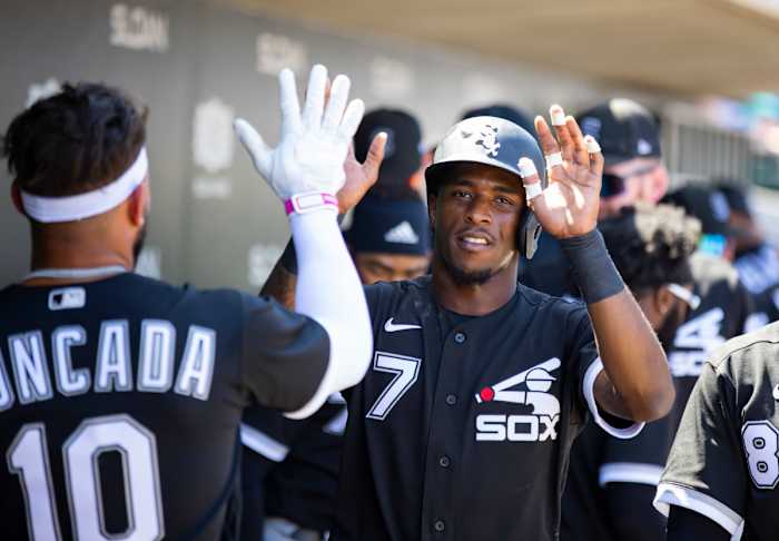 Apr 4, 2022; Mesa, Arizona, USA; Chicago White Sox infielder Tim Anderson (7) celebrates with teammates after scoring against the Chicago Cubs during spring training at Sloan Park. Mandatory Credit: Mark J. Rebilas-USA TODAY Sports