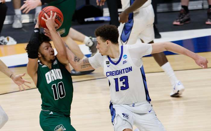 Ohio Bobcats guard Mark Sears (10) tries to hold onto the ball as Creighton Bluejays forward Christian Bishop (13) tries to strip him of it during the second round of the 2021 NCAA Tournament
