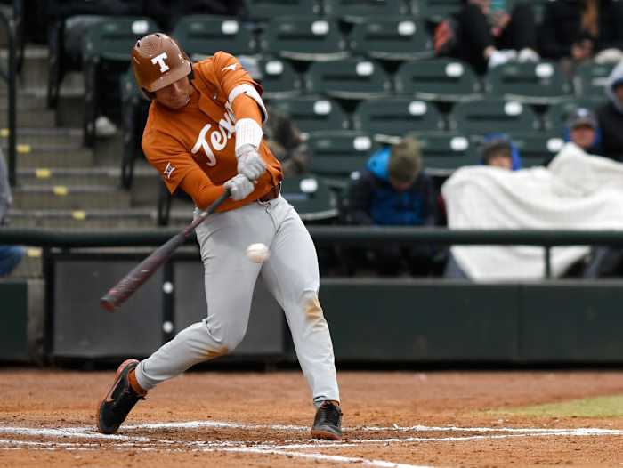 Texas' Ivan Melendez hits the ball against Texas A&M-Corpus Christi, Wednesday, Feb. 23, 2022, at Whataburger Field. Texas won, 5-4