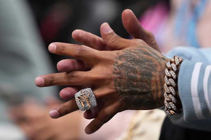 Apr 8, 2022; Miami, Florida, USA; A detailed view of the diamond ring with the words Chosen One worn by Carolina Panthers wide receiver Robbie Anderson as he sits courtside during the second half of the game between the Miami Heat and the Atlanta Hawks at FTX Arena.