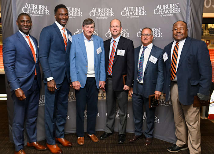 Auburn Dir. of Athletics Allen Greene talks a picture with Marquis Daniels, Jimmy Dozier, Chip Spratlin, Greg Williams and Joe Whitt.Also honored but not present were Emily Carosone, Softball 2013-2016, Kristy Coventry, Swimming 2002-2005 and Stan White, Football 1990-1993,Auburn Tiger Trail program on Friday. April 8, 2022 in Auburn, Ala.