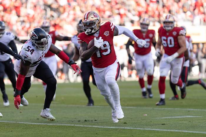 San Francisco 49ers WR Deebo Samuel runs with football
